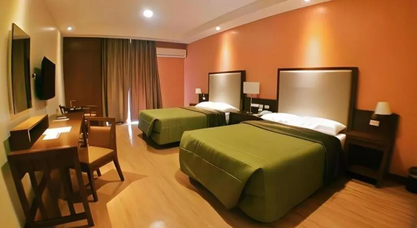 Bed in Mansion Garden Hotel