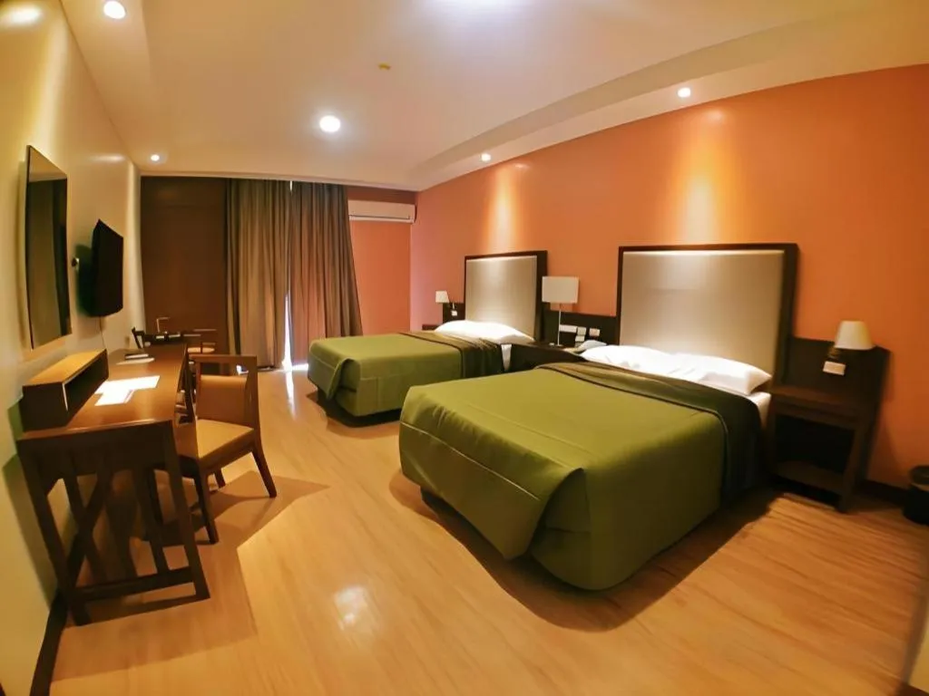 Bed in Mansion Garden Hotel