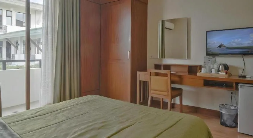 Bed in Mansion Garden Hotel