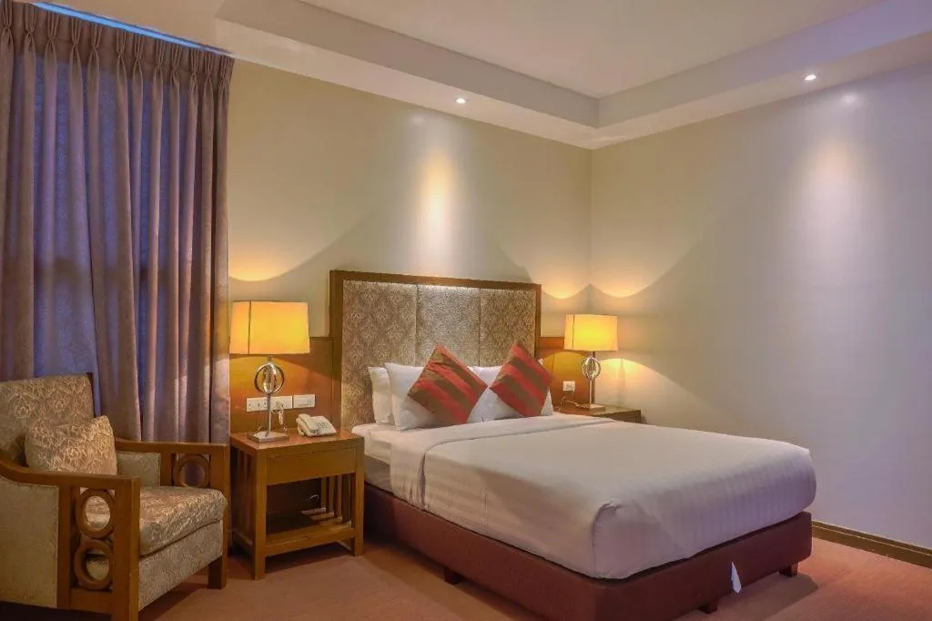 Bed in Mansion Garden Hotel