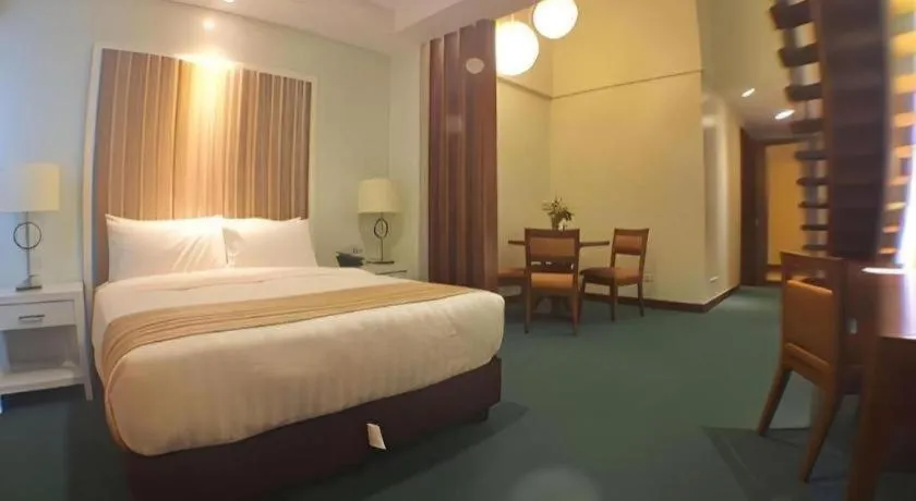 Bed in Mansion Garden Hotel