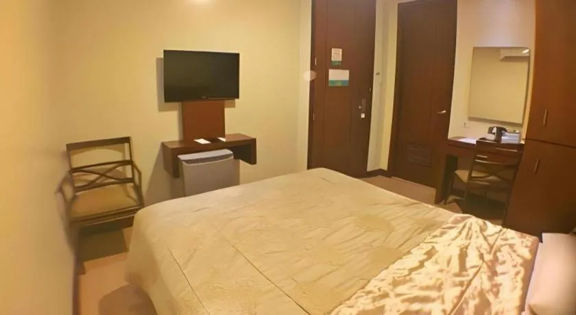 Bed in Mansion Garden Hotel