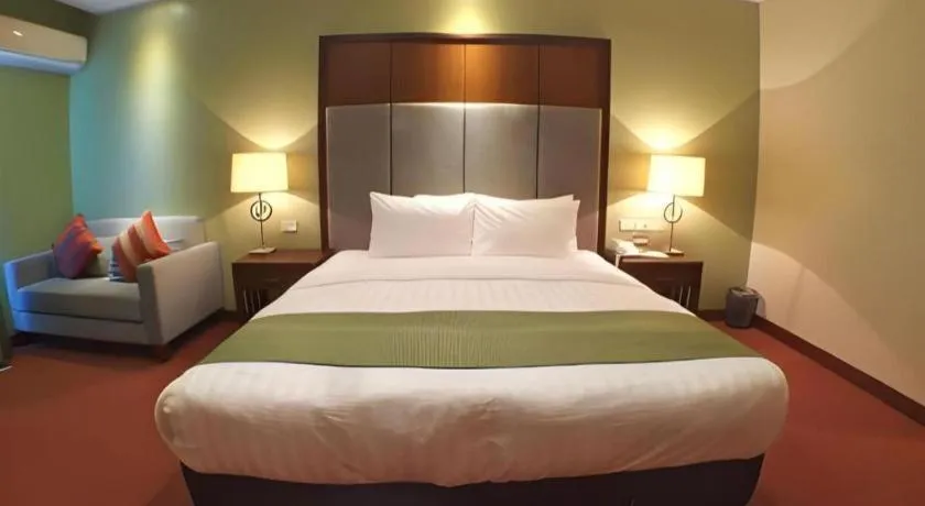 Bed in Mansion Garden Hotel