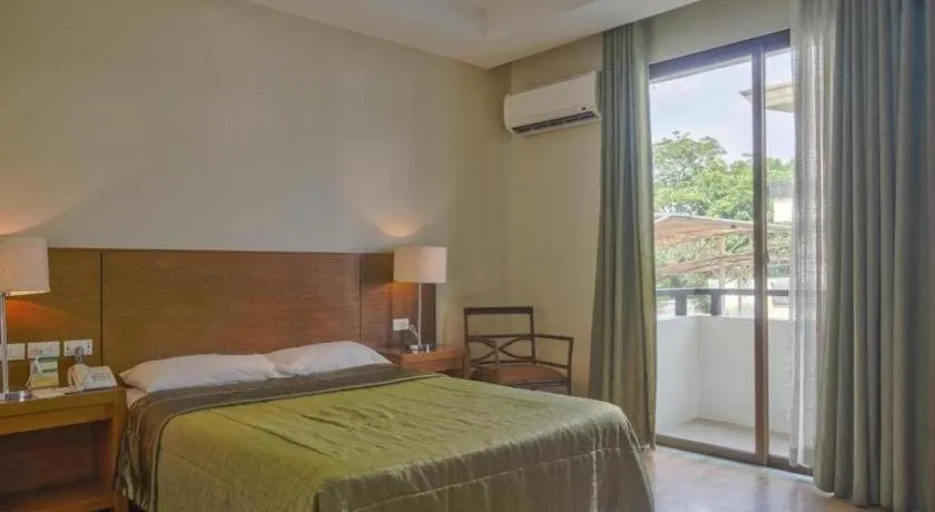 Bed in Mansion Garden Hotel