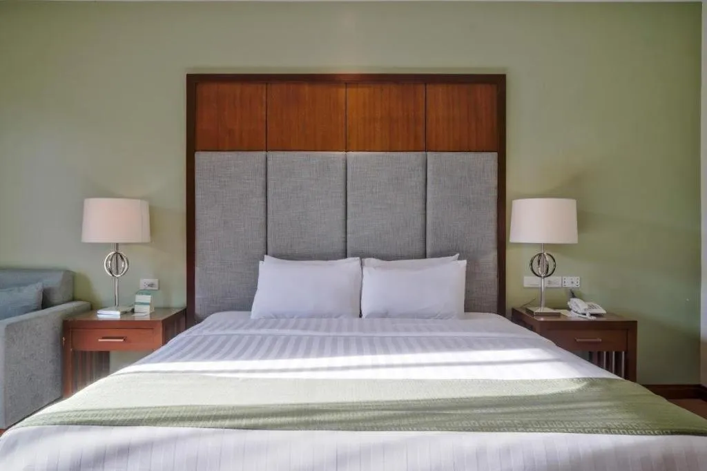 Bed in Mansion Garden Hotel