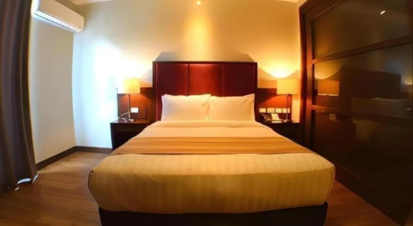 Bed in Mansion Garden Hotel