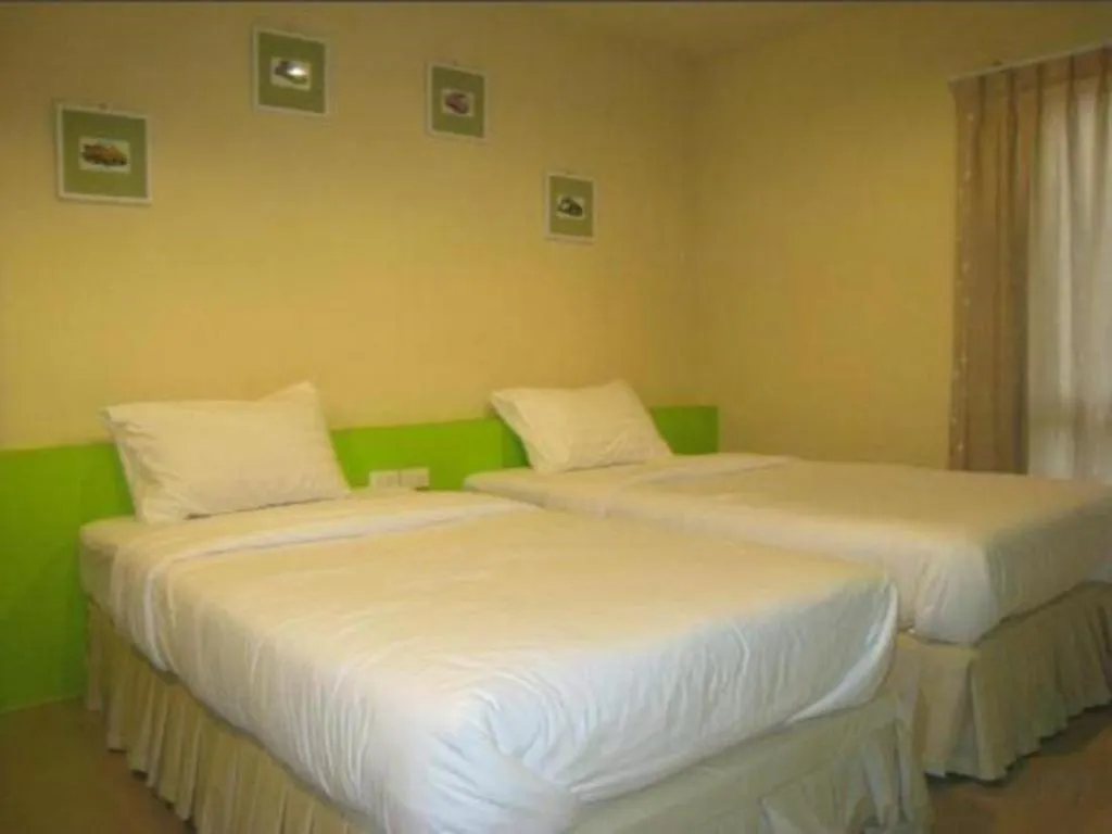 Bed in C2 Residence Hotel