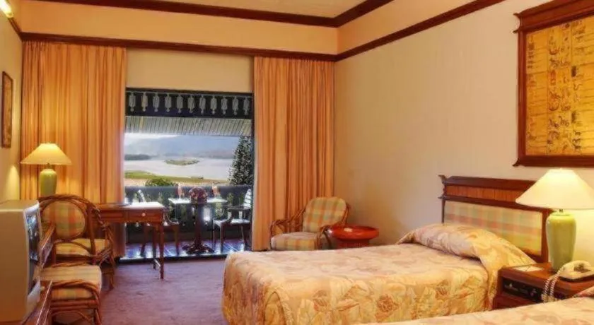 Bed in Imperial Golden Triangle Resort