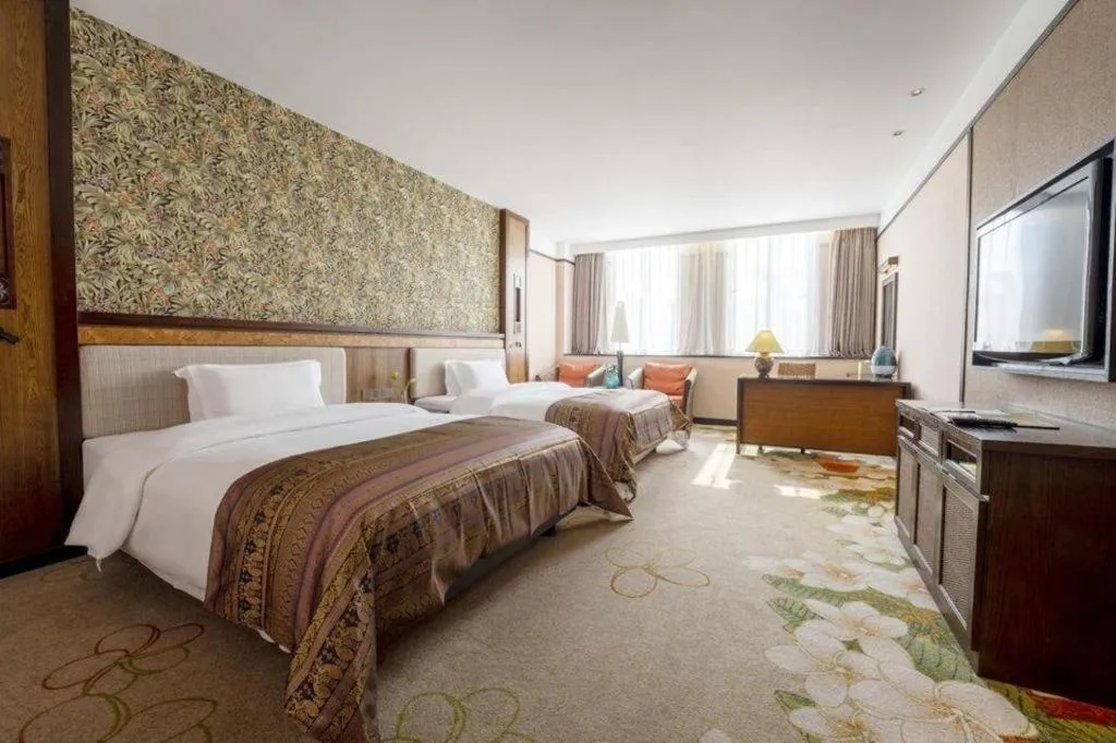 Bed in Riyuegu Hotsprings Resort