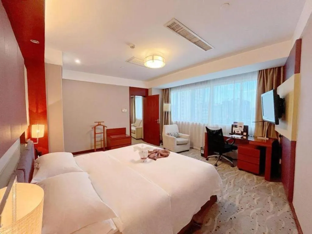 Bed in Xiamen Jingmin Central Hotel