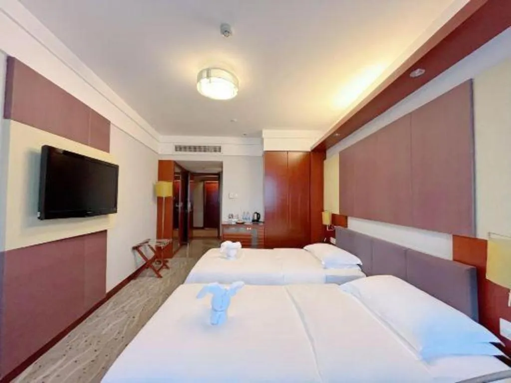 Bed in Xiamen Jingmin Central Hotel