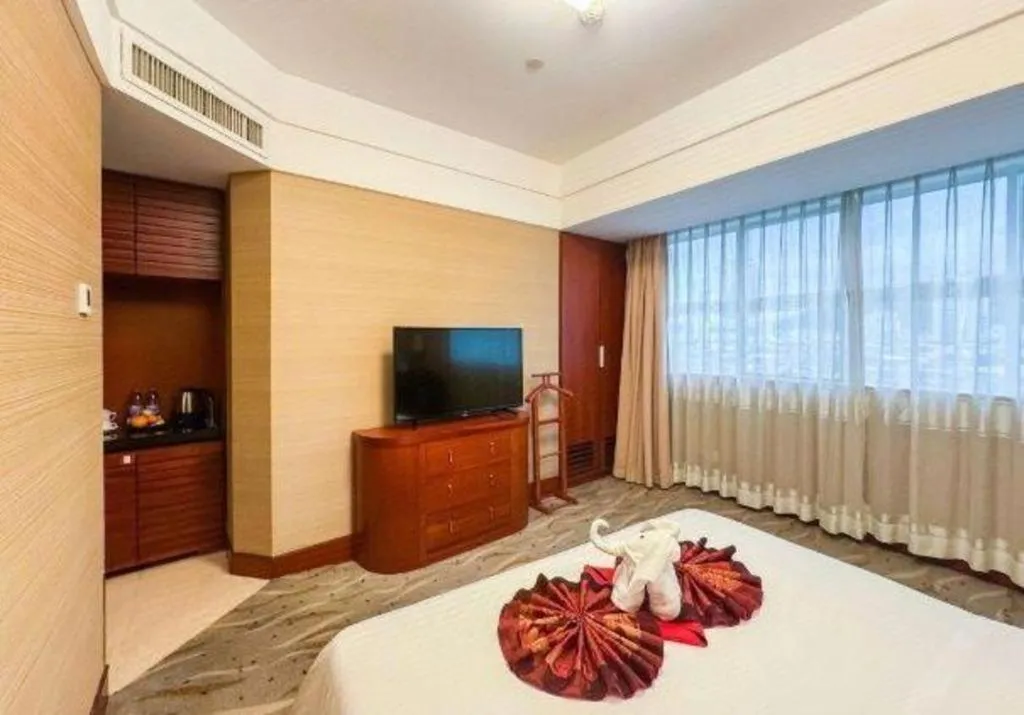 Bed in Xiamen Jingmin Central Hotel