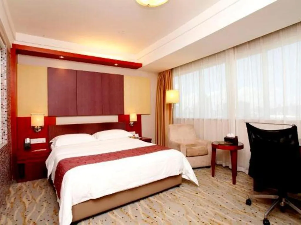 Bed in Xiamen Jingmin Central Hotel