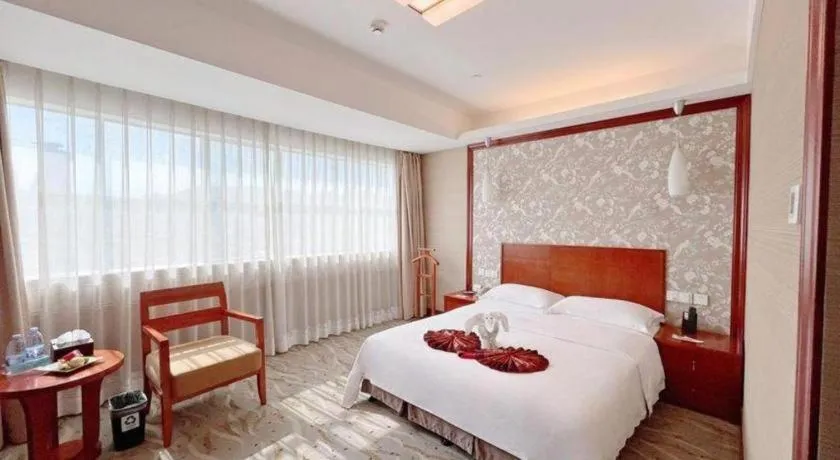Bed in Xiamen Jingmin Central Hotel