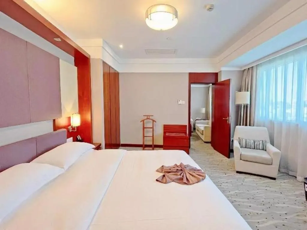 Bed in Xiamen Jingmin Central Hotel