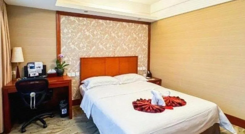 Bed in Xiamen Jingmin Central Hotel