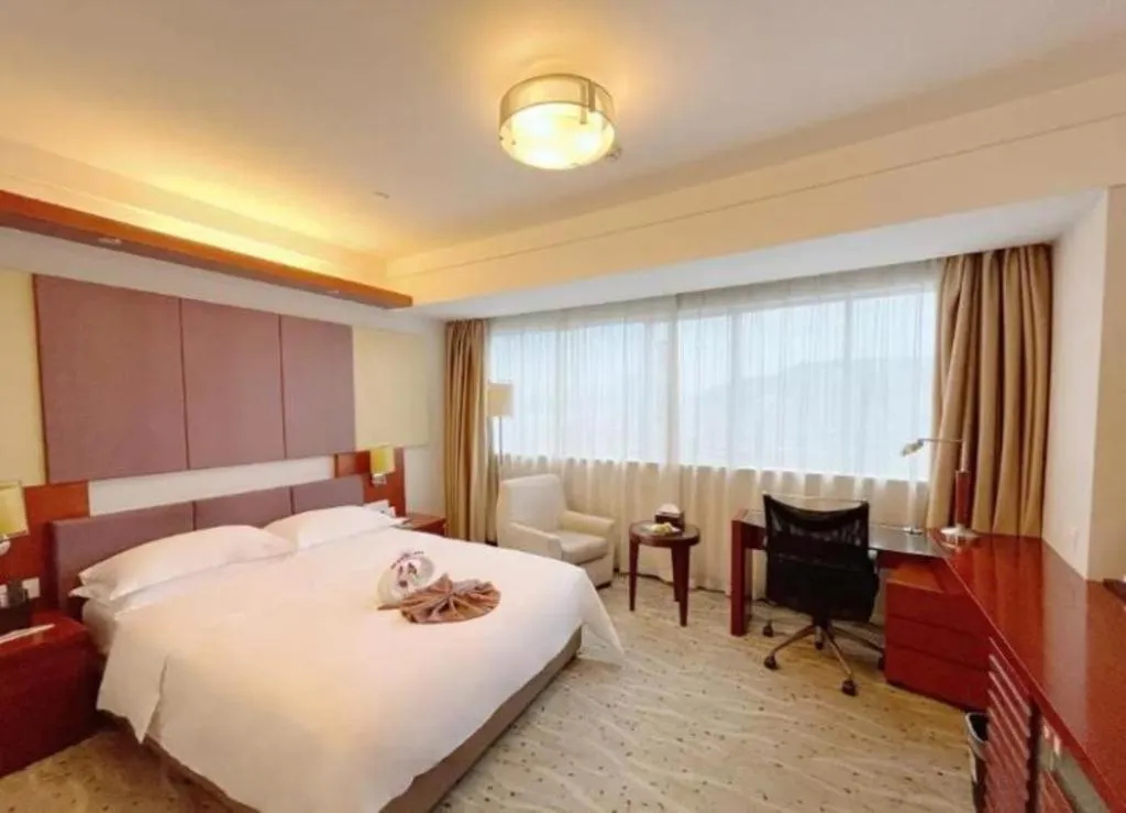 Bed in Xiamen Jingmin Central Hotel