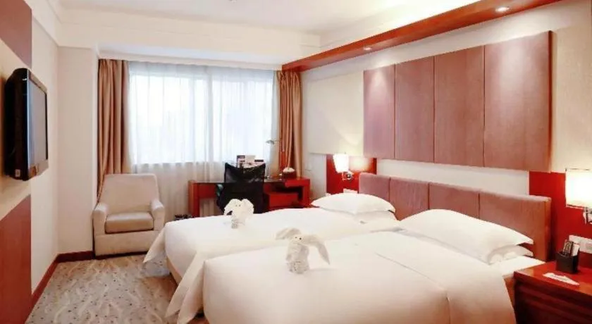 Bed in Xiamen Jingmin Central Hotel