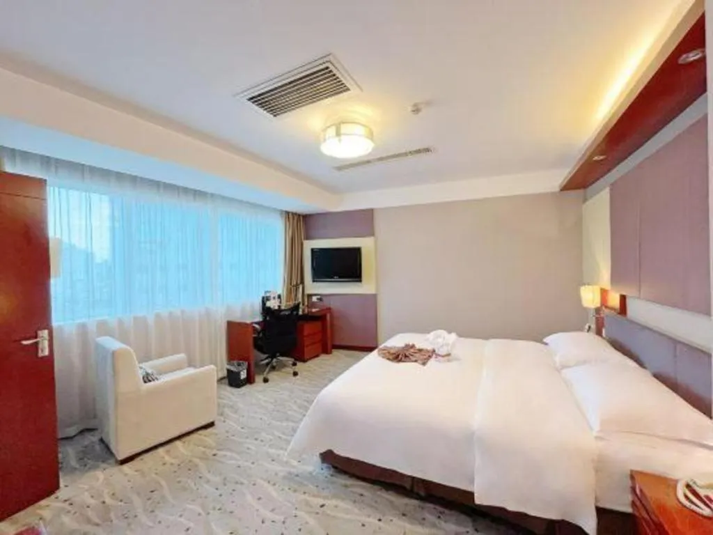 Bed in Xiamen Jingmin Central Hotel