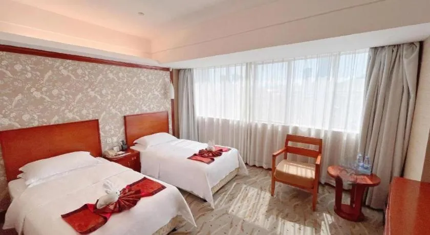Bed in Xiamen Jingmin Central Hotel