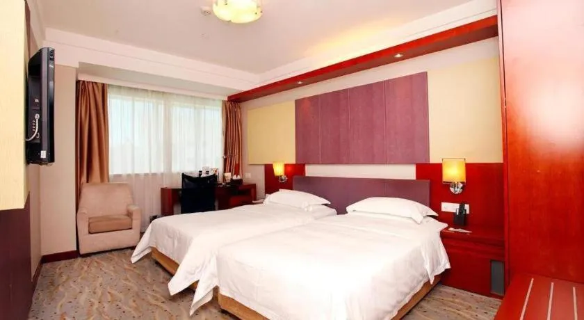 Bed in Xiamen Jingmin Central Hotel