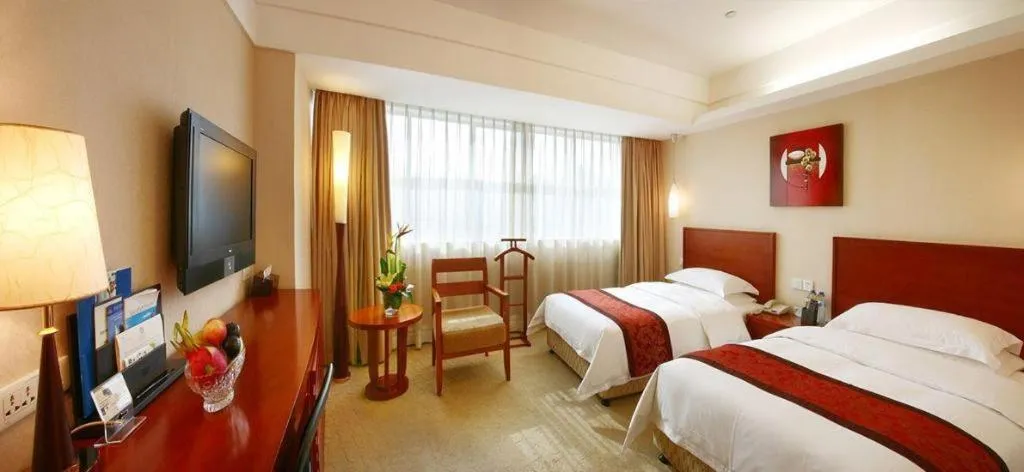 Bed in Xiamen Jingmin Central Hotel