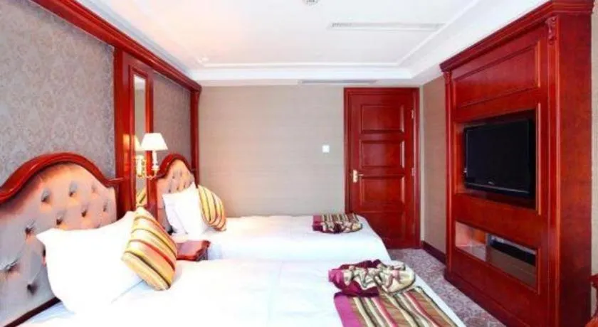 Bed in Xiamen Jingmin Central Hotel