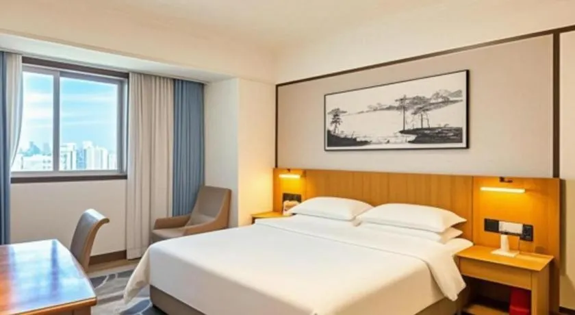 Bed in Xiamen Jingmin Central Hotel