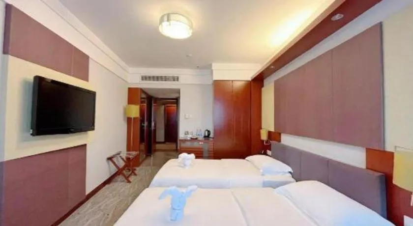 Bed in Xiamen Jingmin Central Hotel