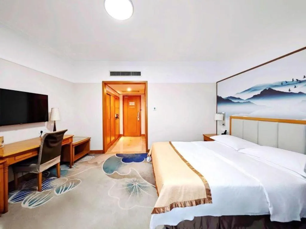 Bed in Xiamen Jingmin Central Hotel