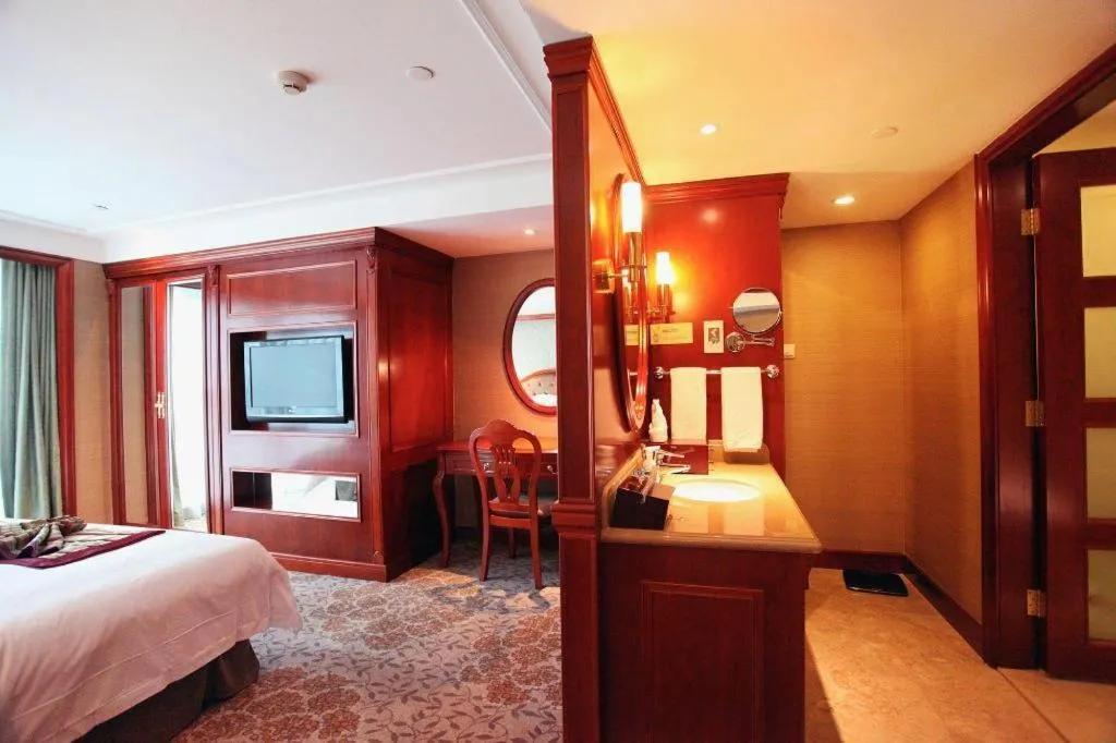 Bed in Xiamen Jingmin Central Hotel