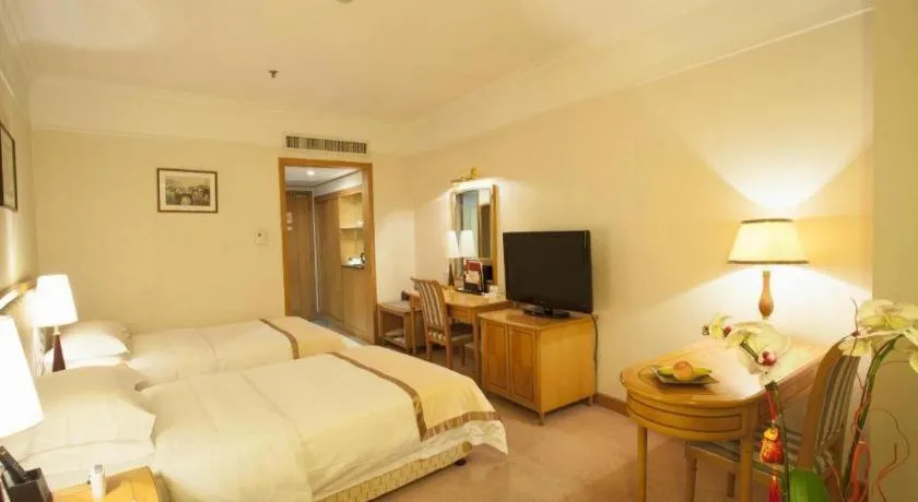 Bed in Xiamen Jingmin Central Hotel