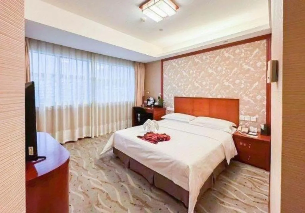 Bed in Xiamen Jingmin Central Hotel