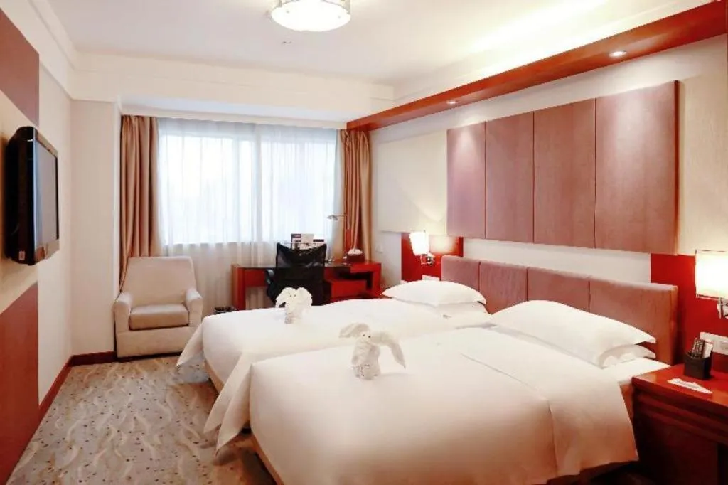 Bed in Xiamen Jingmin Central Hotel
