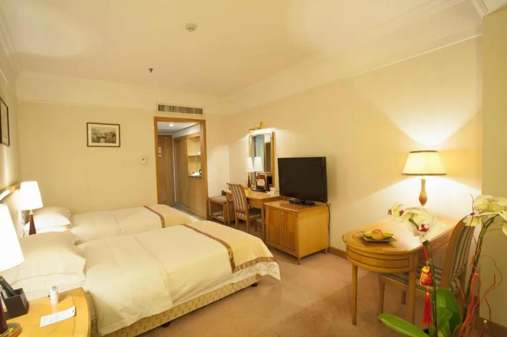 Bed in Xiamen Jingmin Central Hotel