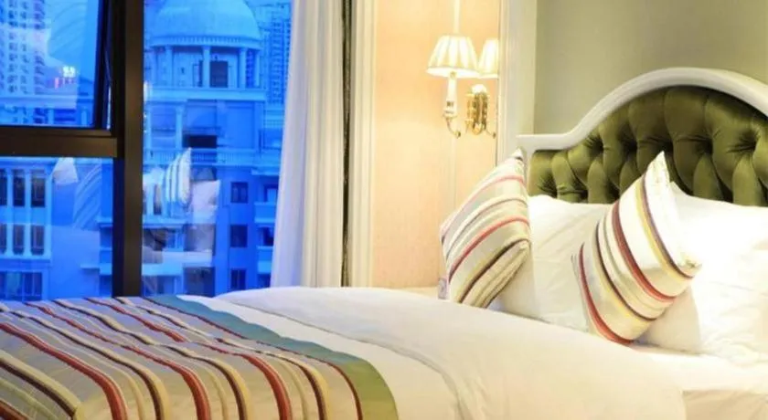 Bed in Xiamen Jingmin Central Hotel