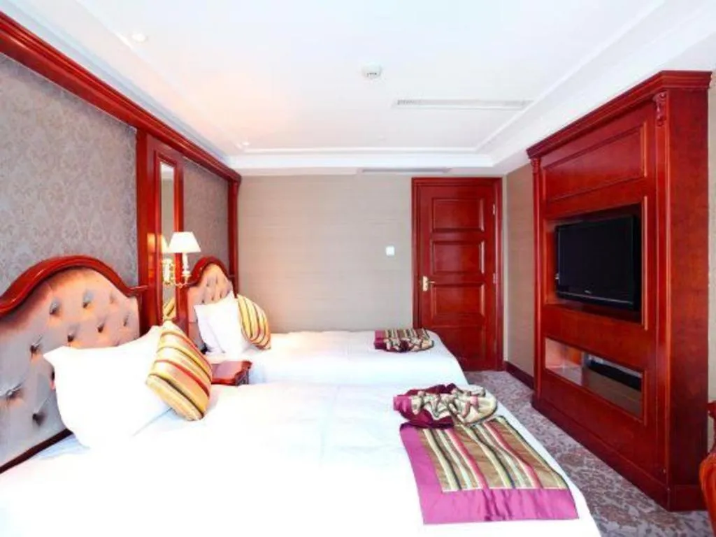 Bed in Xiamen Jingmin Central Hotel