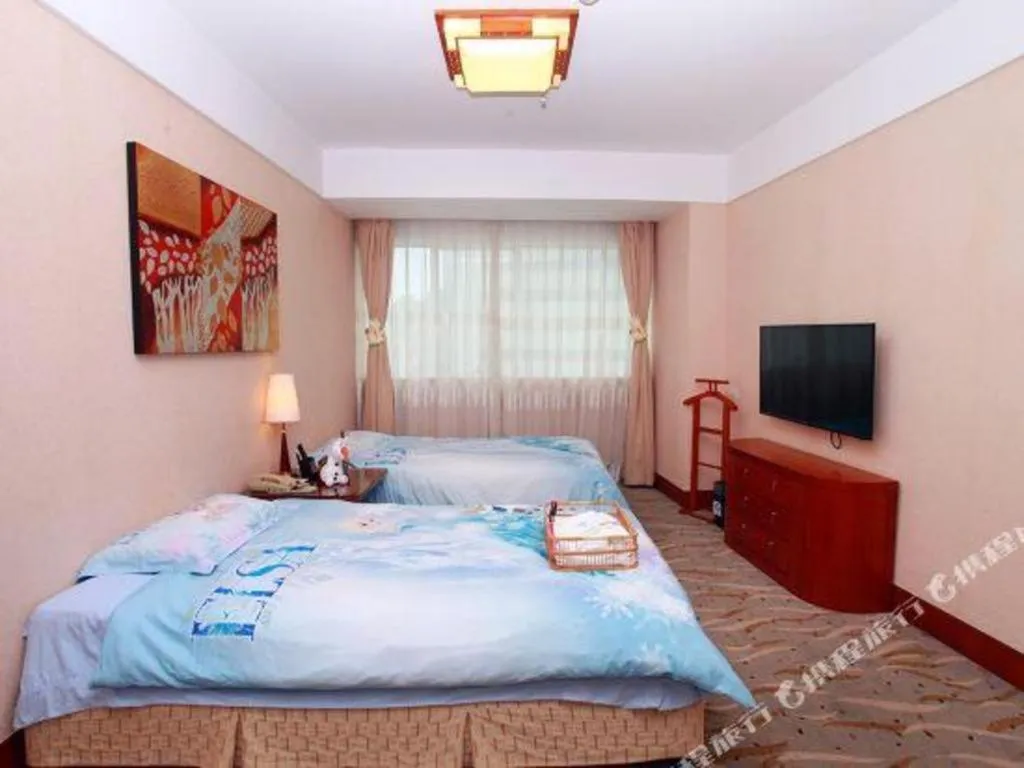 Bed in Xiamen Jingmin Central Hotel