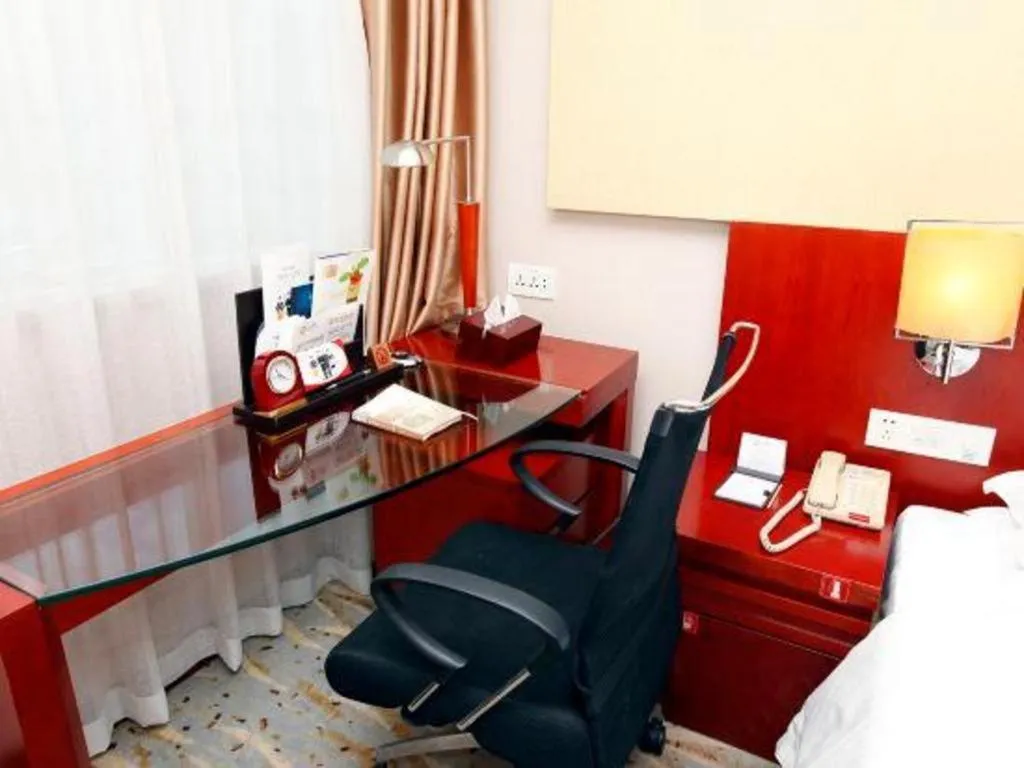 Bed in Xiamen Jingmin Central Hotel