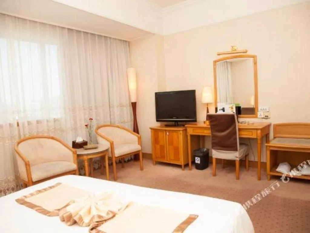 Bed in Xiamen Jingmin Central Hotel