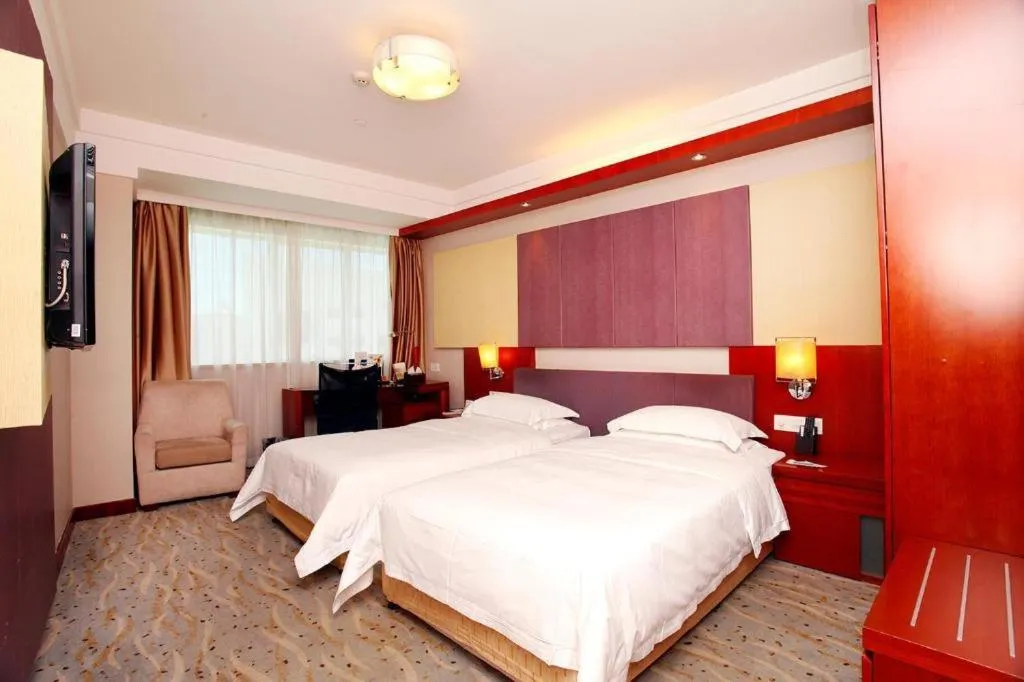 Bed in Xiamen Jingmin Central Hotel