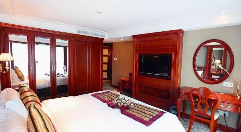 Bed in Xiamen Jingmin Central Hotel