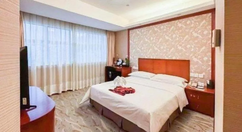 Bed in Xiamen Jingmin Central Hotel