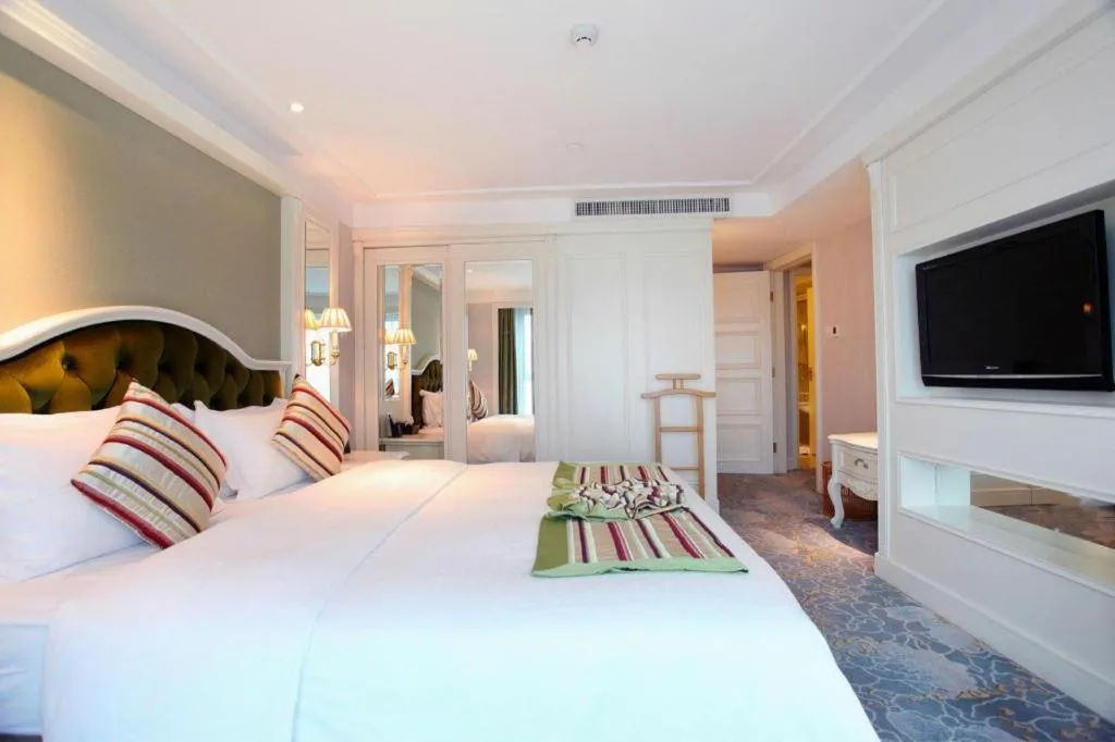 Bed in Xiamen Jingmin Central Hotel