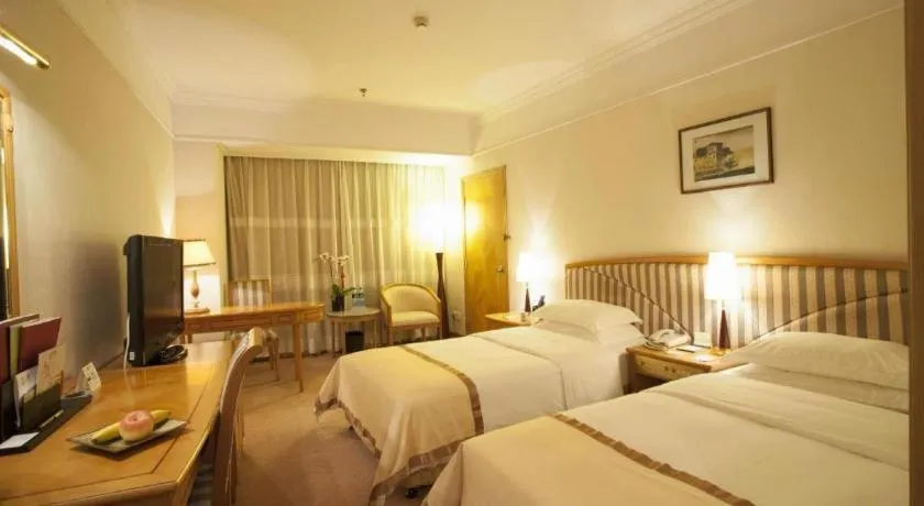 Bed in Xiamen Jingmin Central Hotel