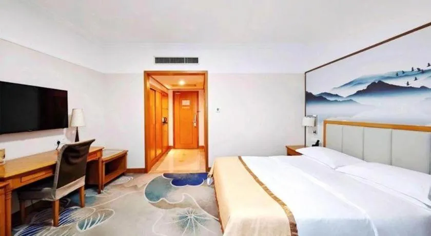 Bed in Xiamen Jingmin Central Hotel