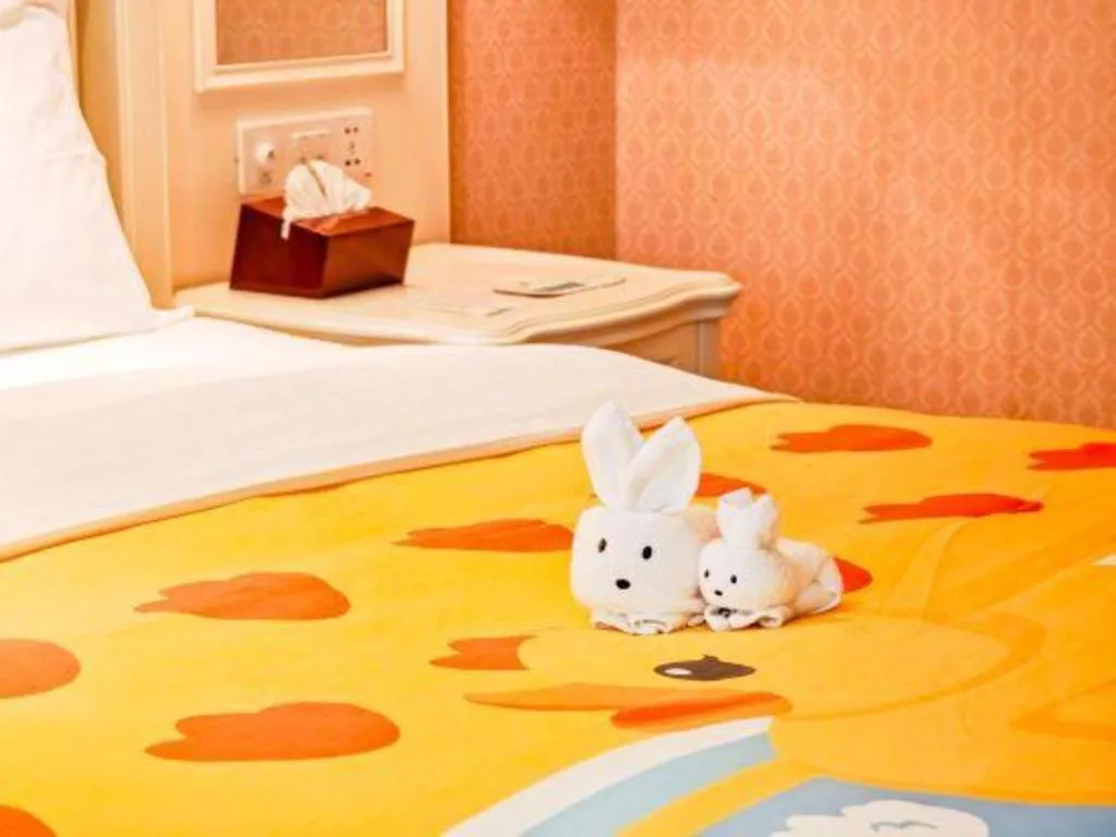 Bed in Xiamen Jingmin Central Hotel