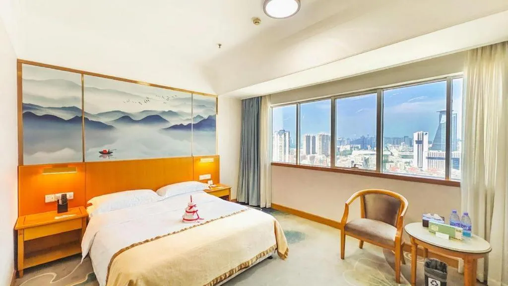 Bed in Xiamen Jingmin Central Hotel