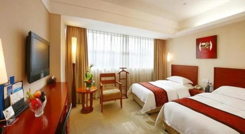 Bed in Xiamen Jingmin Central Hotel