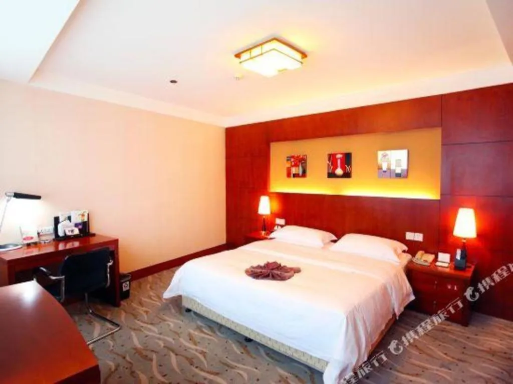 Bed in Xiamen Jingmin Central Hotel